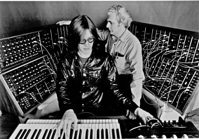 Bob Moog and Wendy Carlos collaborating in the studio, representing the perfect partnership between inventor and artist